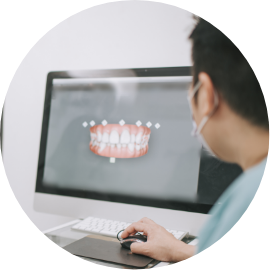 A man shows a 3D graphic of a denture.